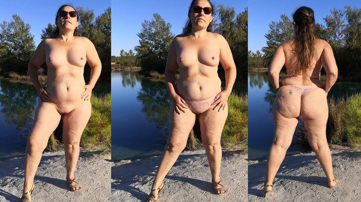 Rellenita nudista desnuda en un lago